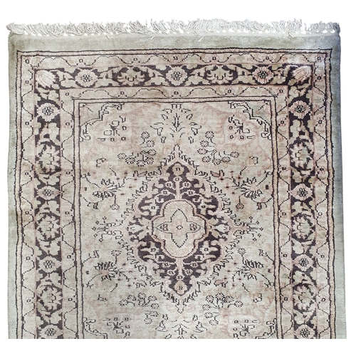 94 - A Persian style green ground Runner with multi borders and a repeating central medallion design. 78 ... 