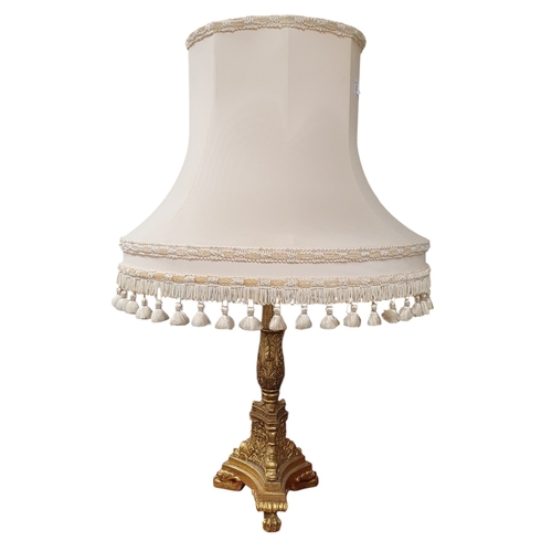 62 - A gold coloured Table Lamp with shade. H 48 cm approx.