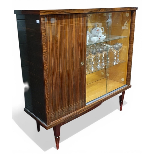 18 - A fantastic Retro Rosewood three door Display Cabinet with twin glazed sliding doors beside single p... 