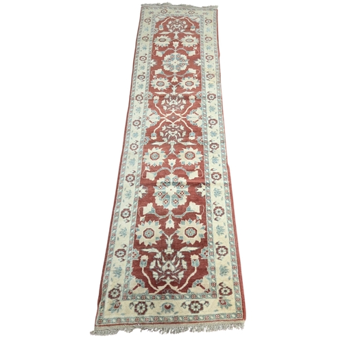 17 - A Zeigler style cream ground Runner. 296 x 81 cm approx.