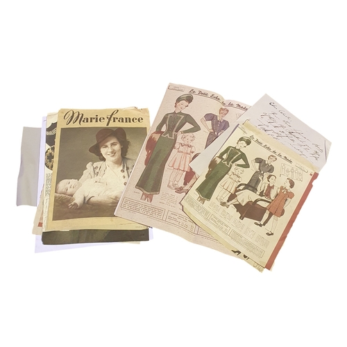 5 - A Box of assorted fabrics, a photo album from 1944, selection of Vinyl records and dress making prin... 
