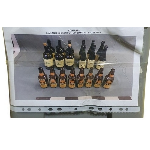 8 - A Quantity of labeled Brown beer Bottles along with a box of note books, magazines ect.