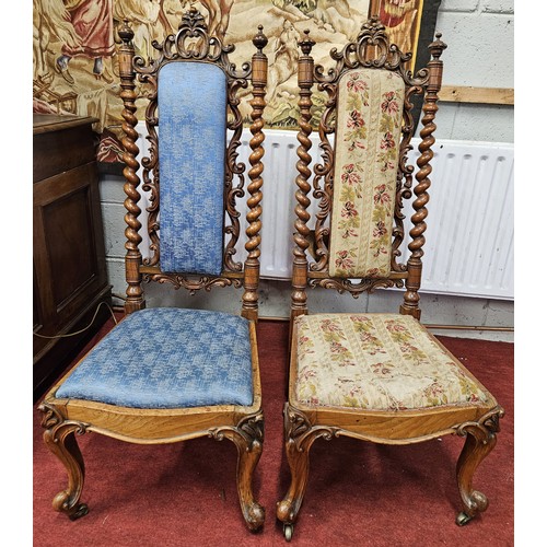 44 - A pair of 19th Century Rosewood Hall Chairs with highly pierced back. With different coloured uphols... 