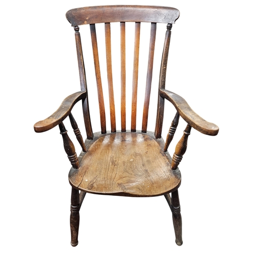 773 - A 19th Century Ash Windsor Chair on turned supports. W 65 x SH 37 x BH 100 cm approx.