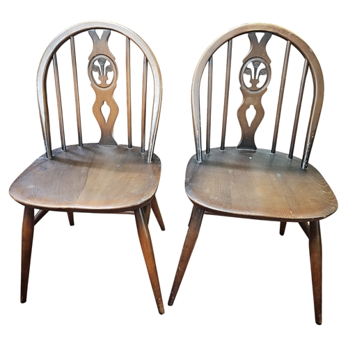 784 - A pair of Ercol Kitchen Chairs. W 42 x SH 42 x BH 83 cm approx.