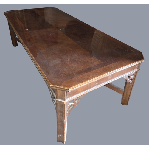 779 - A modern rectangular Coffee Table with canted corners along with a wicker rocking chair and another.