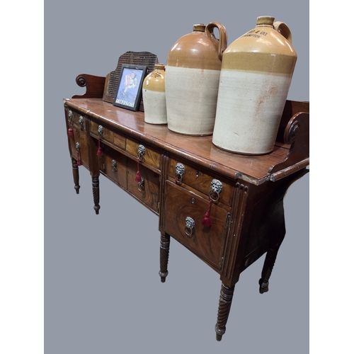 761 - A Regency Mahogany Irish Sideboard with lions head ring handles and turned barley twist supports.
W ... 