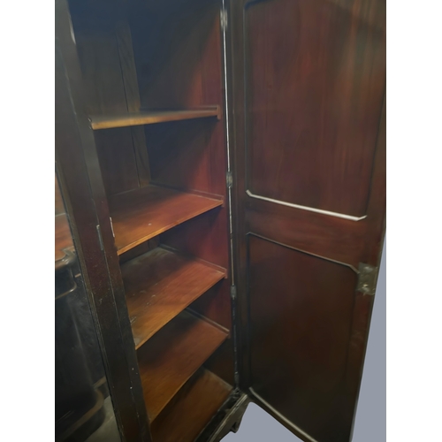 766 - An early 20th Century Mahogany three door Wardrobe with mirrored centre and serpentine outline.
W 17... 