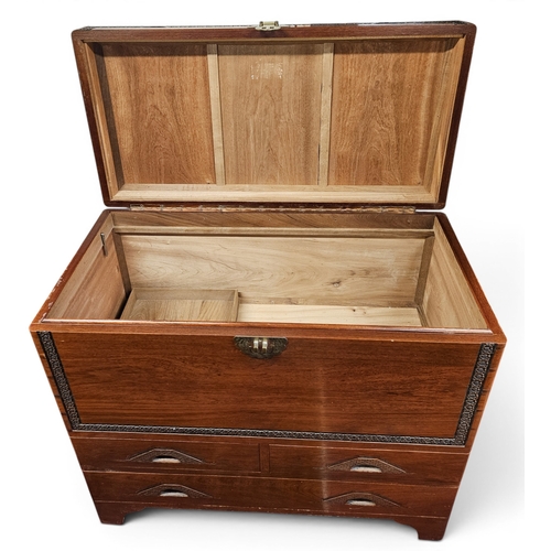 26 - A large Oriental Camphorwood Chest with lift up lid and frieze drawer base. 101x 51 x H 90 cm approx... 