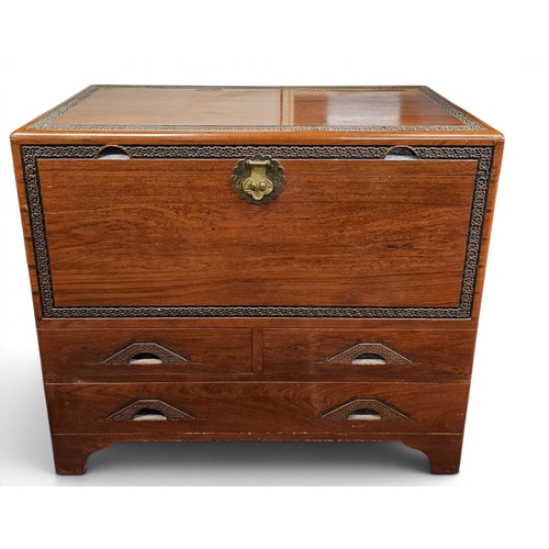26 - A large Oriental Camphorwood Chest with lift up lid and frieze drawer base. 101x 51 x H 90 cm approx... 