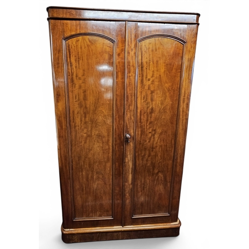 30 - A 19th Century Mahogany two door Wardrobe. W 114 x 54 x H 198 cm approx.