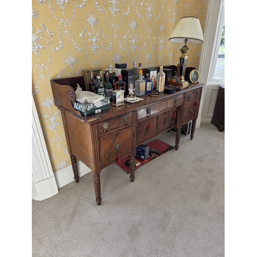 761 - A Regency Mahogany Irish Sideboard with lions head ring handles and turned barley twist supports.
W ... 