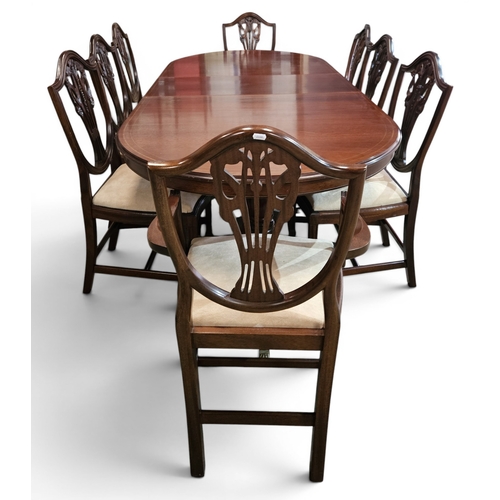 A good Regency style Reproduction Mahogany single leaf Dining Table along with eight shield back chairs to include two carvers.
Table H 77 x W 106 x L 243 (fully extended) cm approx.