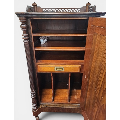 21 - A late 19th early 20th Century Mahogany Side Cabinet with a mirrored panel door on turned fluted sup... 