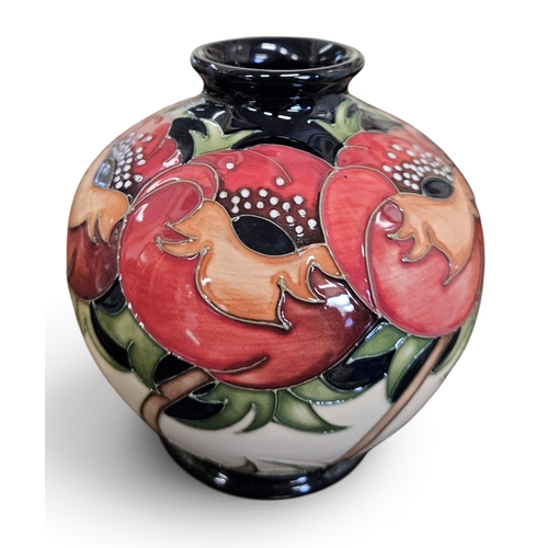 55 - W. Moorcroft & Sons. A Moorcroft 'Meo Voto' pattern Vase, by Rachel Bishop. H 11 cm approx.