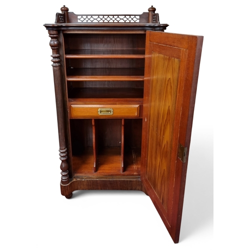 21 - A late 19th early 20th Century Mahogany Side Cabinet with a mirrored panel door on turned fluted sup... 