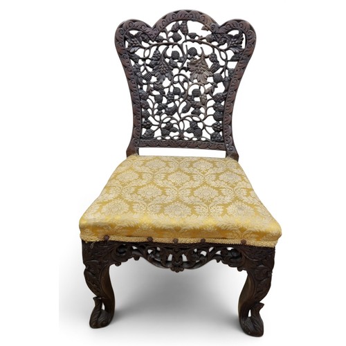 52 - A pair of 19th Century Oriental hardwood Paduka Chairs with pierced backs.
W 49 x SH 40 x BH 89 cm a... 