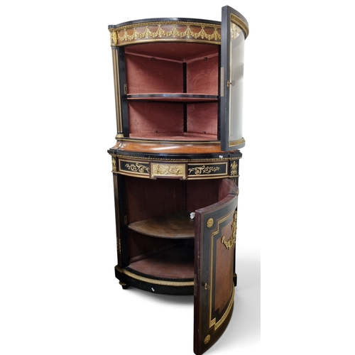 54 - An extremely large Continental Ebonised and Amboyna Veneered Corner Cabinet profusely mounted with o... 