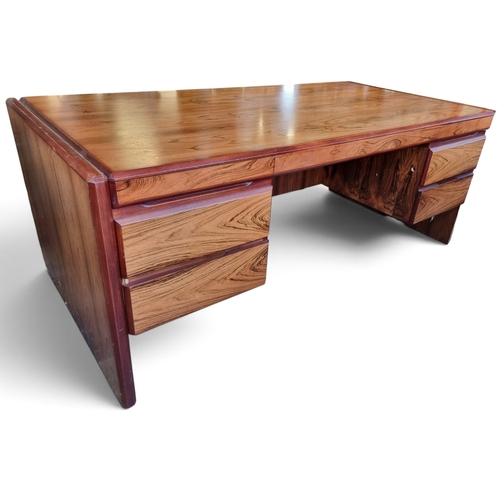 23 - A mid Century Rosewood and Veneered Desk.
W 189 x D 94 x H 73 cm approx.