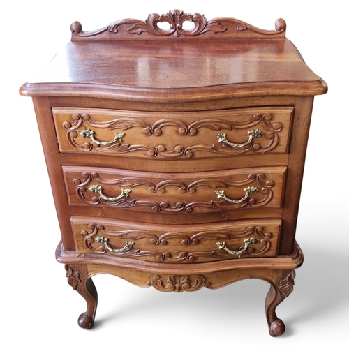 25 - A pair of Mahogany Side Cabinets with profusely carved outline and serpentine fronts.
W 57 x D 34 x ... 