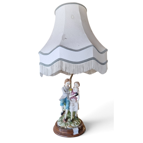39 - A Capodimonte style table lamp along with another. TB 63 cm approx.
