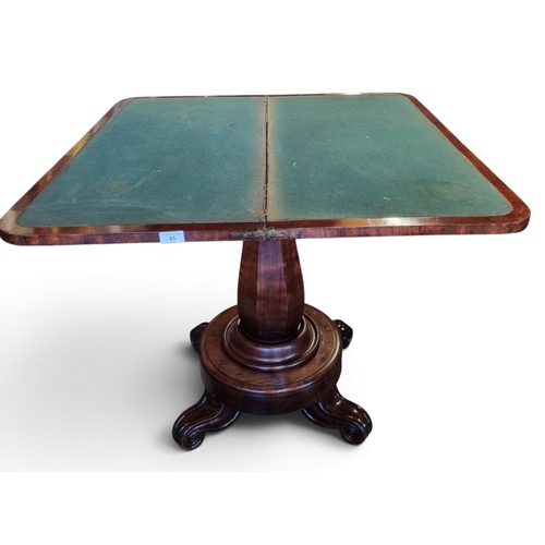 45 - A Regency Mahogany foldover Card Table on hexagonal support, with platform base and carved canted le... 