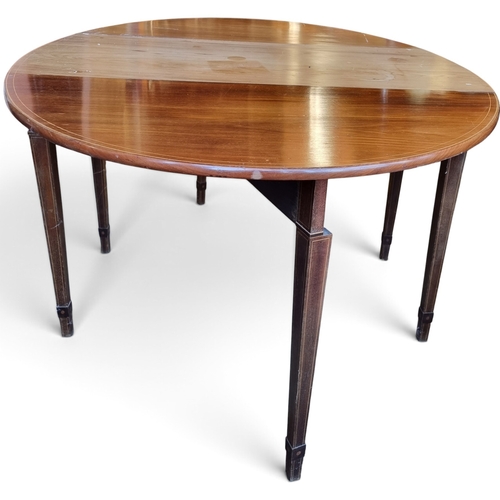 7 - A 19th Century Mahogany dropleaf Table with highly inlaid outline on square tapered supports.
W 109 ... 