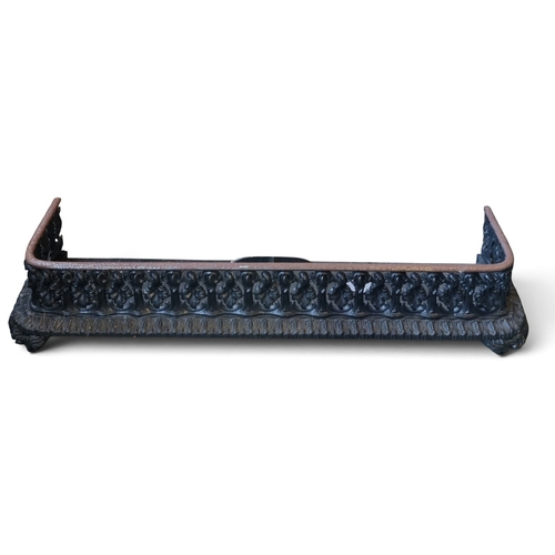 8 - A 19th Century pierced Brass Fender.
Inside ope W 110 x Inside ope D 25 cm approx along with another... 