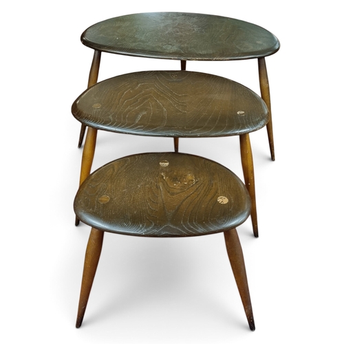 4 - A good graduated Ercol nest of Tables with brochure. W 64 x H 40 cm approx.