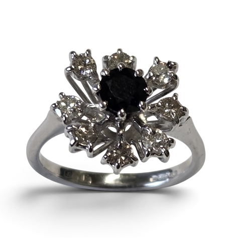 An 18ct Gold, Diamond and Sapphire cluster Ring size K.