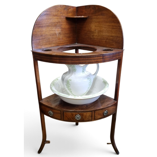 71 - A Georgian Mahogany Corner Washstand with frieze drawer centre along with a washbowl and jug early 2... 