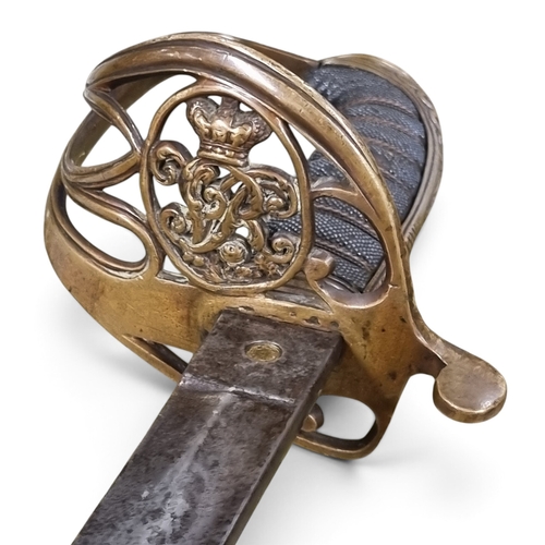 106 - A British 1845 model Infantry Officers Sword with gothic style pierce Brass hilt and a wire bound an... 