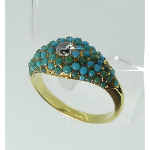 106 - A small 19thC Ring, the flared front pave set with turquoise and central diamond, all mounted in unm... 