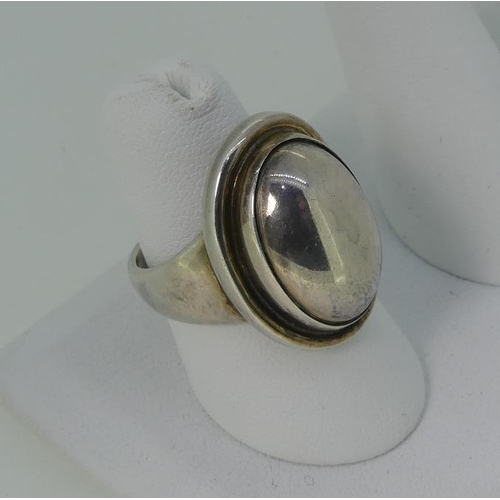 111 - A Georg Jensen sterling silver Ring, pattern no 46, the front set as a silver cabochon, the reverse ... 