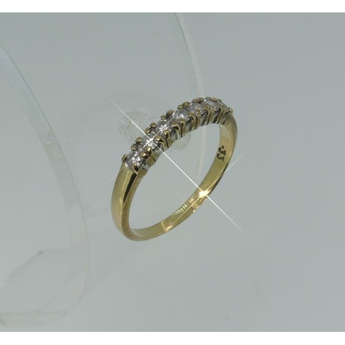 112 - A seven stone diamond Ring, all mounted in 9ct yellow gold, Size O.