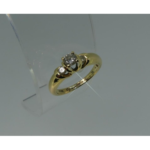 115 - A three stone diamond Ring, mounted in 18ct yellow gold, Size M.