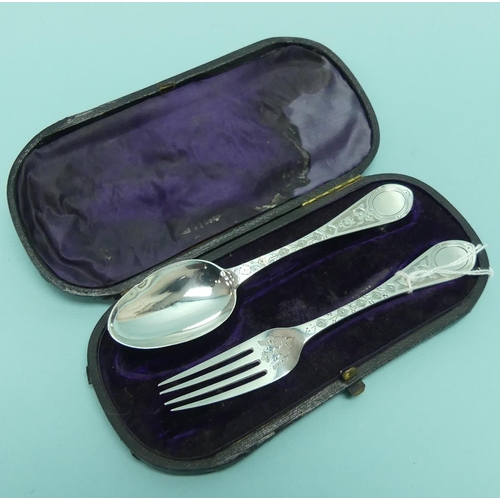 20 - A cased Victorian silver Christening Spoon and Fork Set, by H J Lias & Son, hallmarked London, 1870,... 