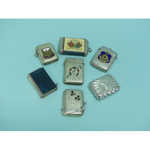 51 - A collection of seven silver plated Vesta Cases; one 'Scottish Market' inset with agate, another 'Ir... 