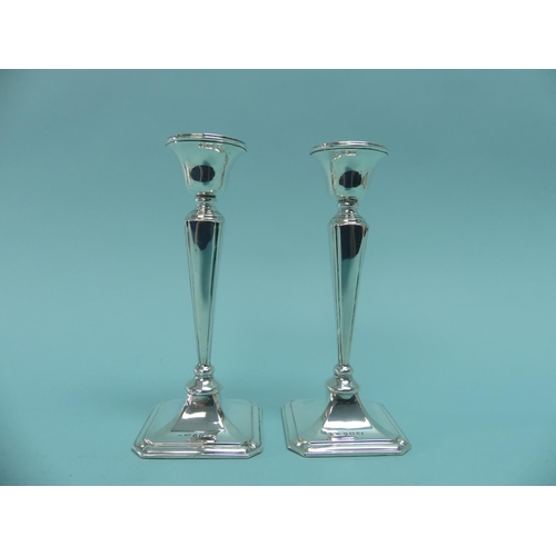 69 - A pair of George V silver Candlesticks, by Cornelius Desormeaux Saunders & James Francis Hollings (F... 