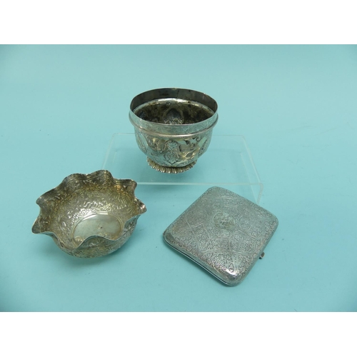 93 - An unmarked Indian silver Bowl, with wavy rim, the whole chased with animals amongst trees, 3½in (9c... 