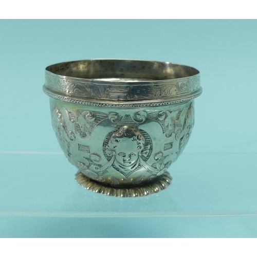 93 - An unmarked Indian silver Bowl, with wavy rim, the whole chased with animals amongst trees, 3½in (9c... 