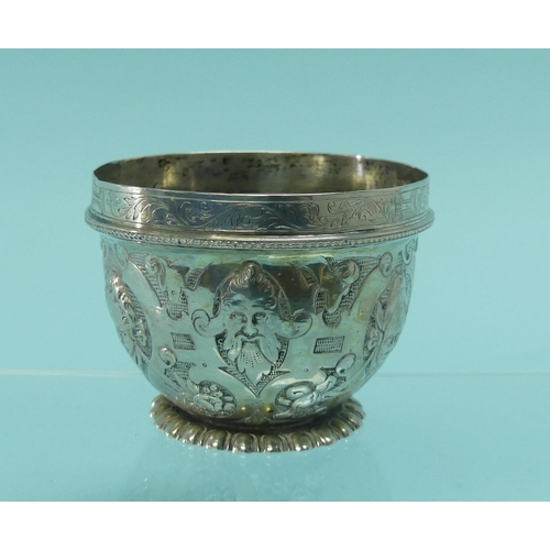 93 - An unmarked Indian silver Bowl, with wavy rim, the whole chased with animals amongst trees, 3½in (9c... 