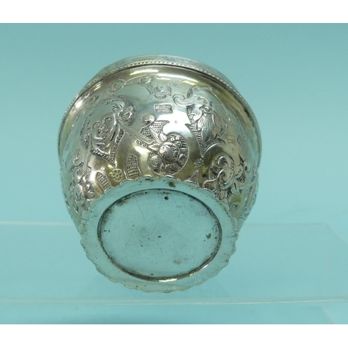 93 - An unmarked Indian silver Bowl, with wavy rim, the whole chased with animals amongst trees, 3½in (9c... 