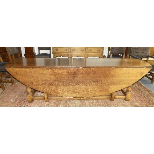 107 - An impressive 17thC style oak oval gate-leg Dining Table, by Bryn Hall Bespoke Furniture with shaped... 