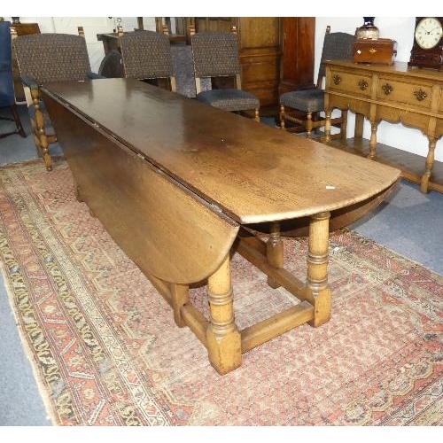 107 - An impressive 17thC style oak oval gate-leg Dining Table, by Bryn Hall Bespoke Furniture with shaped... 