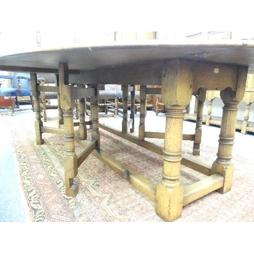 107 - An impressive 17thC style oak oval gate-leg Dining Table, by Bryn Hall Bespoke Furniture with shaped... 