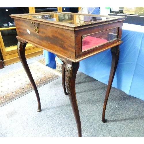 119 - A late 19thC oak Bijouterie Table, raised on carved cabriole legs, 24in (61cm) wide.