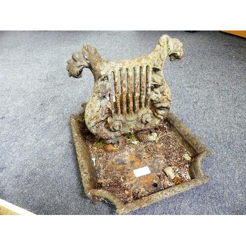 122A - A substantial Victorian cast iron Boot scraper, in the form of a lyre, 16in (41cm) wide x 12in (30.5... 