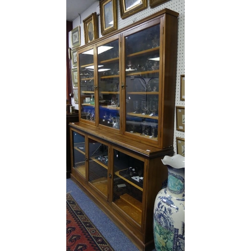 126 - An early 20thC wooden shop display floor-standing Wall Cabinet, the lower part fitted with a shelf b... 