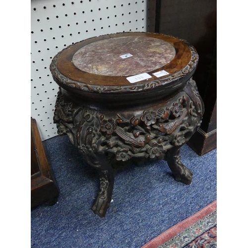 133 - A 19thC oriental hardwood Plant Stand, intricately carved with cherry blossom and birds, the circula... 